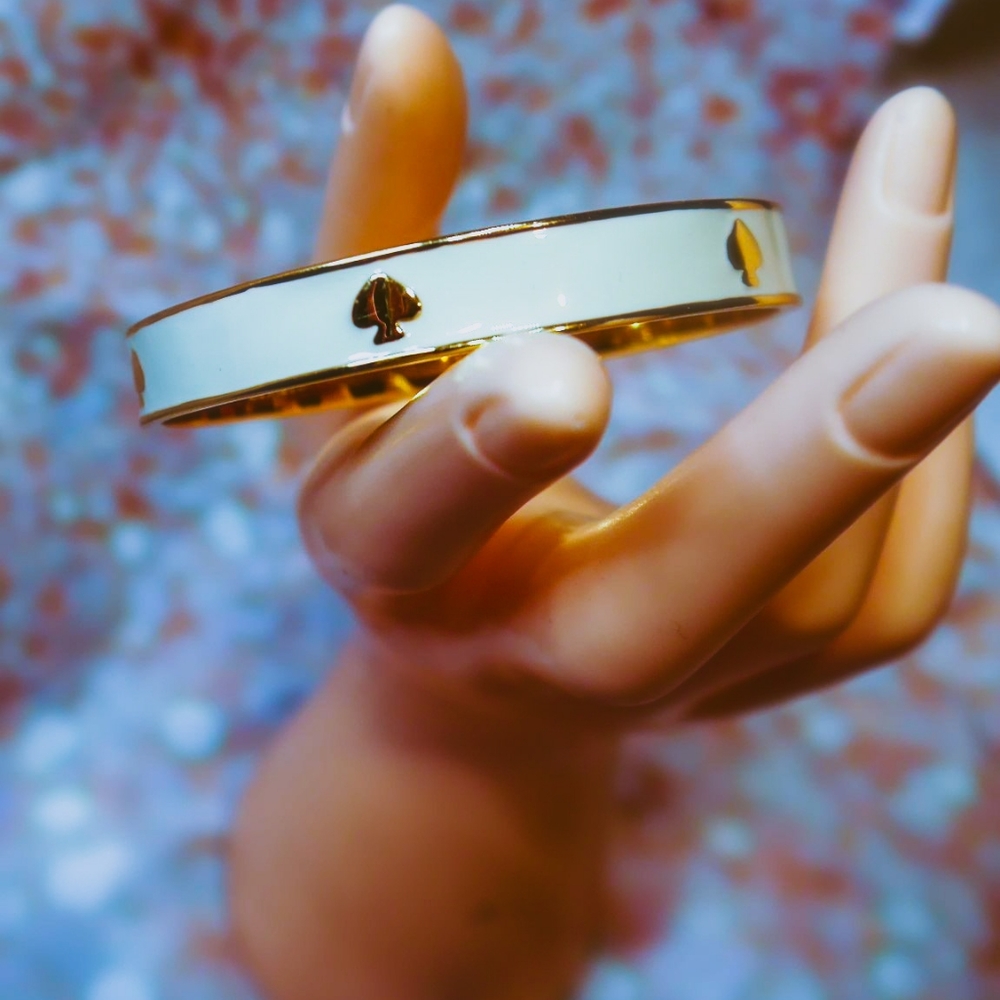 Sold Kate Spade cream and gold Bangle